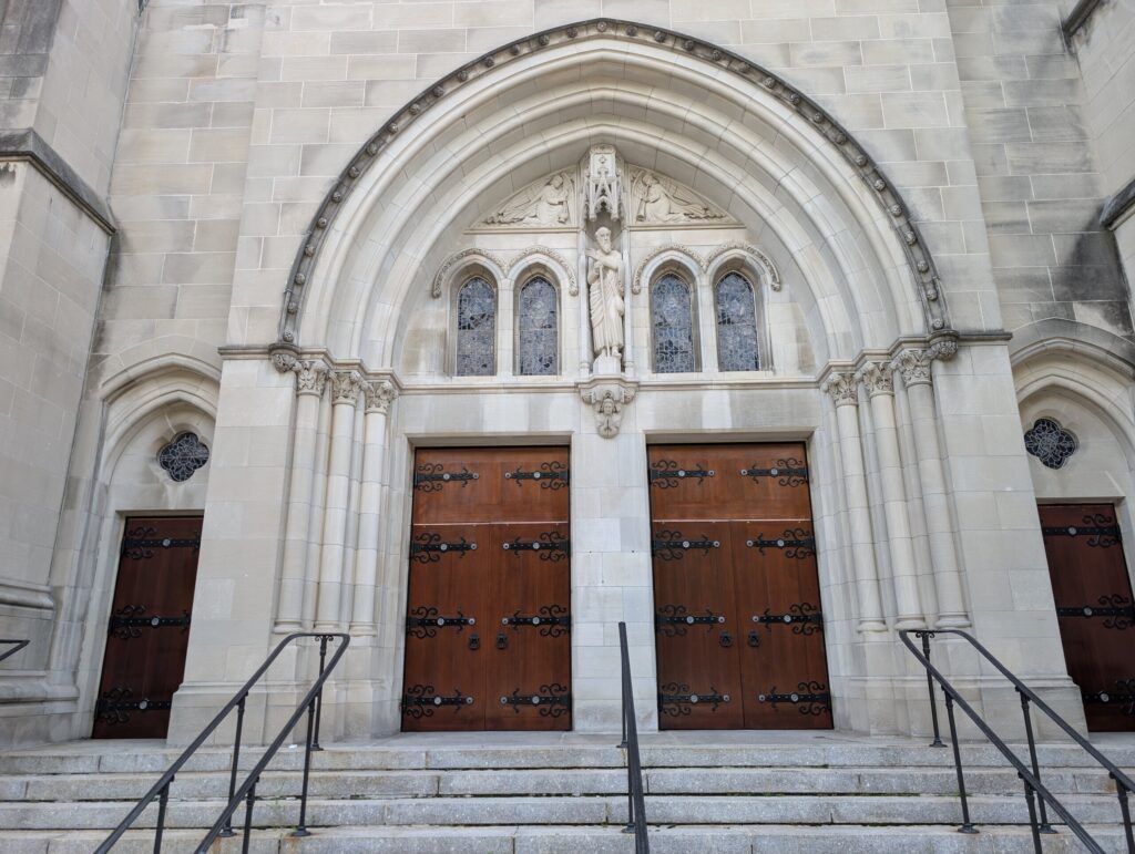 Riverside Church Gothic stone portal with monumental historic double wood entrance doors