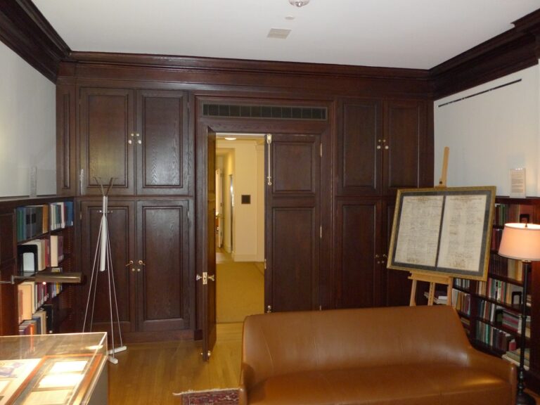 Dark wood library paneling and built-in cabinetry at the Roosevelt townhouse